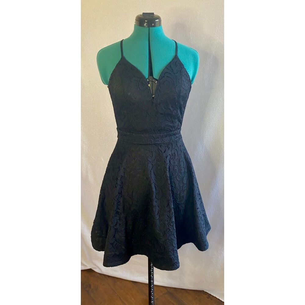 Trac black lace dress with back zipper detail. Size medium